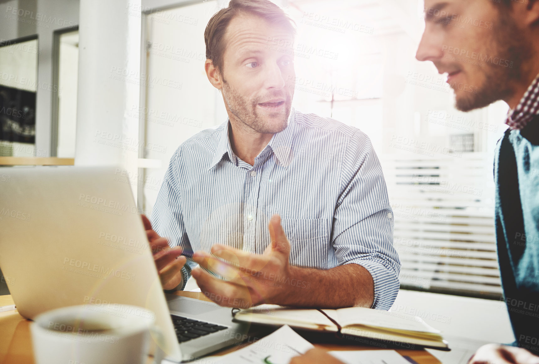 Buy stock photo Cropped shot of two businessmen in the office