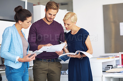 Buy stock photo Cropped shot of a group of designers working in their office