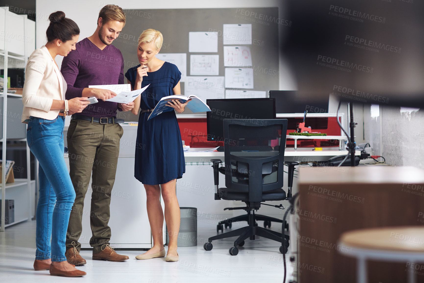 Buy stock photo Full length shot of a group of designers working in their office