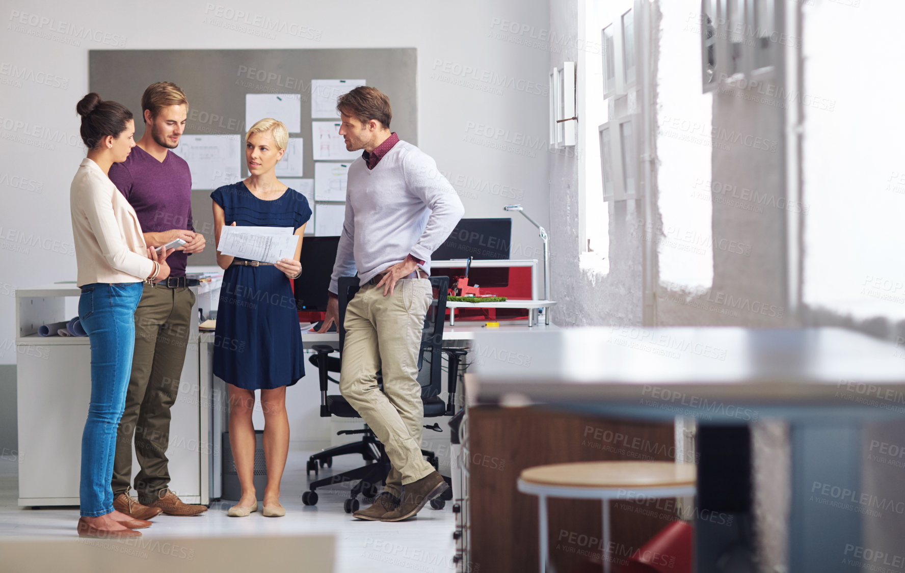 Buy stock photo Full length shot of a group of designers working in their office