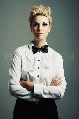 Buy stock photo Portrait, bow tie or woman with fashion, vintage clothes and arms crossed on grey background. Classy aesthetic, edgy female model or confident girl with retro style and cool makeup isolated in studio