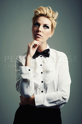 Buy stock photo Thinking, bow tie or person with fashion, ideas or vintage clothes on grey background in studio. Classy aesthetic, edgy model or confident woman isolated with retro style, beauty and cool makeup 
