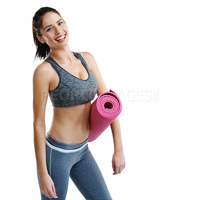 Buy stock photo Studio shot of a fit young woman holding an exercise mat isolated on white