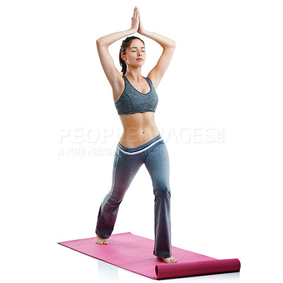 Buy stock photo Studio shot of a fit young woman doing yoga isolated on white