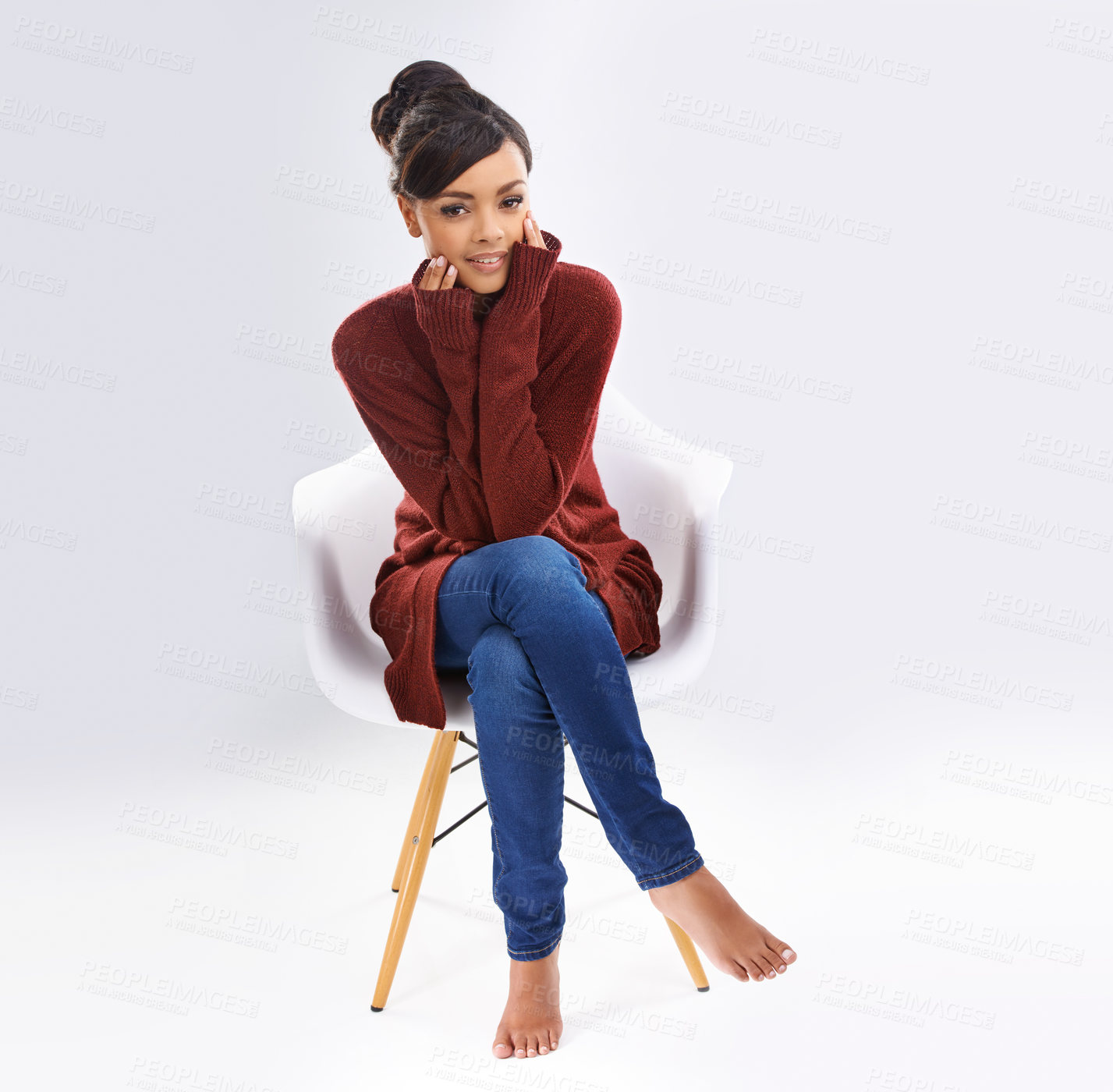 Buy stock photo Fashion, smile and portrait of woman in studio with casual, trendy and stylish outfit for winter. Chair, confident and female person from Colombia with clothes for cold season by white background.