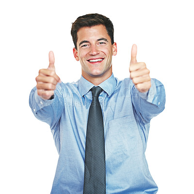 Buy stock photo Studio portrait of a young businessman showing thumbs up against a white background