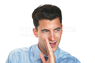 Buy stock photo Studio shot of a young businessman telling a secret against a white background