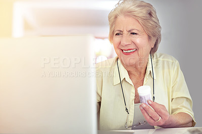 Buy stock photo Shot of a senior woman researching her medication online