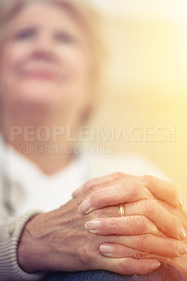 Buy stock photo An elderly woman's hands clasped together on her lap