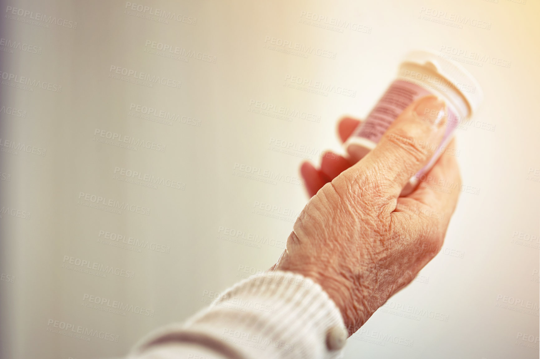 Buy stock photo Medicine, woman and hands with a bottle of pills for recovery, health and wellness. Healthcare, medication and closeup of a senior female person with prescription tablets, supplements or vitamins.