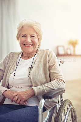 Buy stock photo Cropped shot of a senior woman sitting in her wheelchair at home