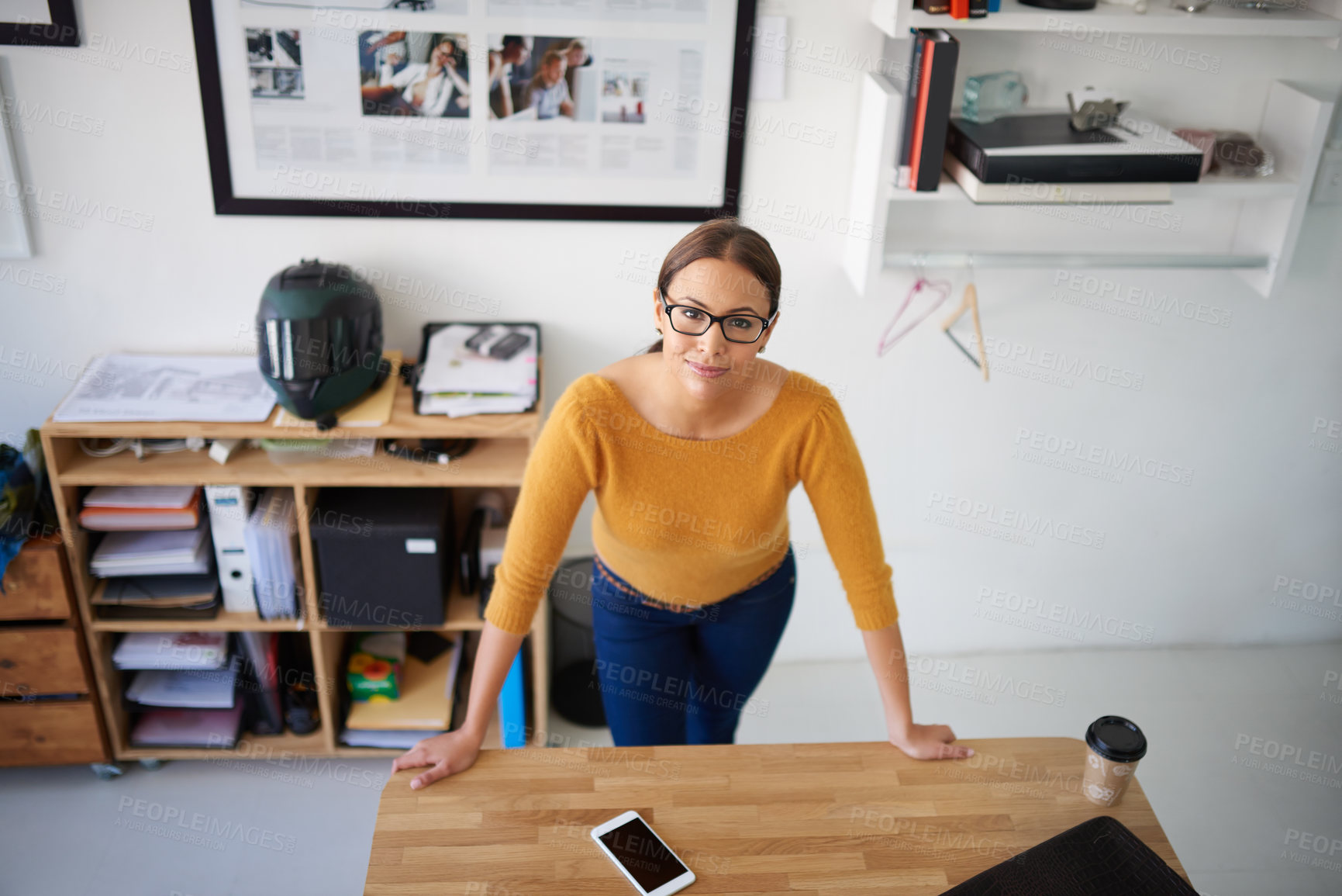 Buy stock photo Office, desktop and above woman with project in creative workplace with confidence and commitment. Person, portrait and hard work in company as manager of administration or planning productivity