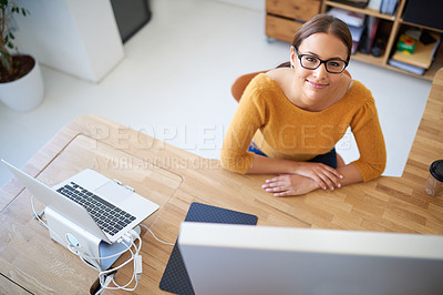 Buy stock photo High angle portrait of a young female designer at her desk