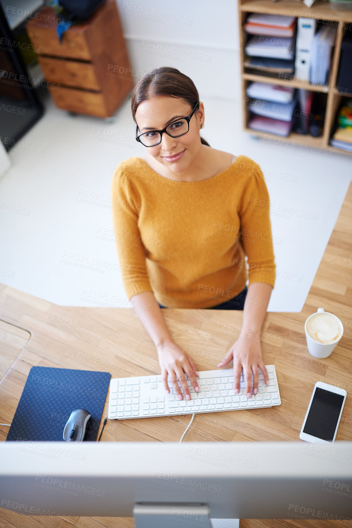 Buy stock photo Above, computer and woman in office with project in creative workplace with administration in reception. Happy, person and secretary typing email or report in company and productivity as receptionist