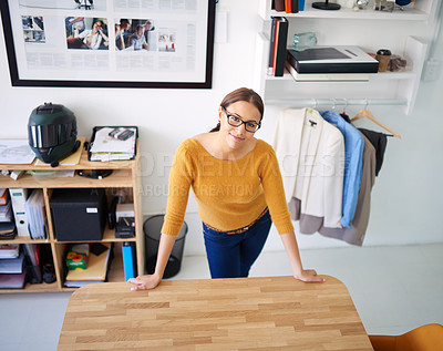 Buy stock photo Office, portrait and woman at desk with project in fashion, creative workplace and confident designer. Happy, person and start hard work task, productivity and employee in retail, startup or company