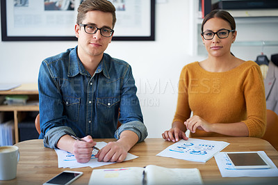 Buy stock photo Portrait of two colleagues working together on a creative project