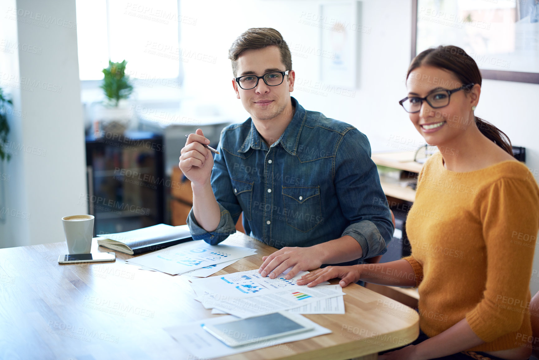 Buy stock photo Portrait of two colleagues working together on a creative project