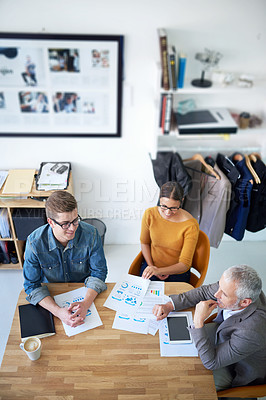 Buy stock photo Cropped shot of a group of coworkers brainstorming during a meeting