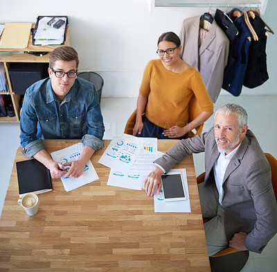 Buy stock photo Portrait of creative businesspeople having a meeting around a table