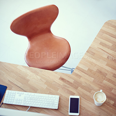 Buy stock photo High angle shot of an empty chair at a workstation
