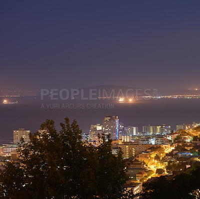 Buy stock photo Night, city and trees or ocean view with buildings, skyscraper and travel or tourism. Water, architecture and luxury hotel or hospitality for urban vacation and landscape or dark with sea and street