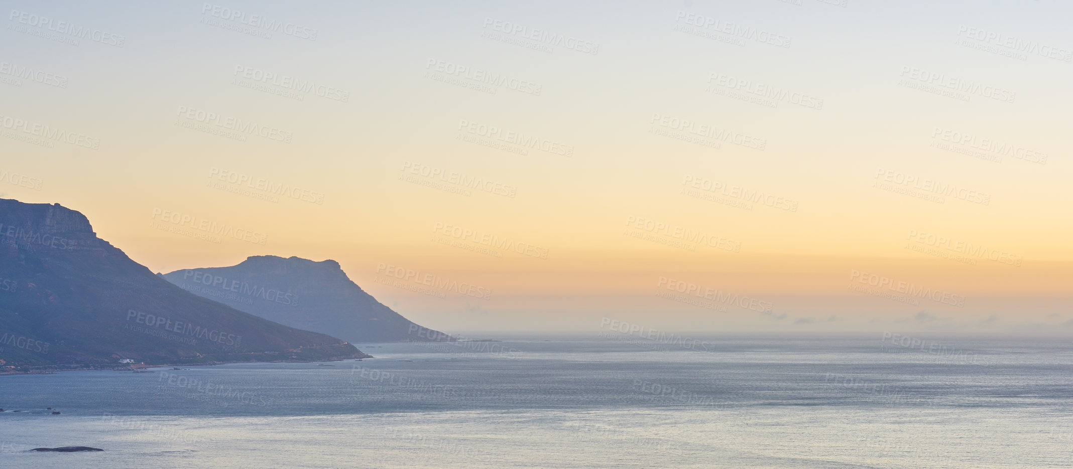 Buy stock photo Mountain, sunset and ocean scenery with nature or horizon for peace, travel destination and holiday location. Seascape, sky and sea water for vacation landscape, panorama or environment on coast