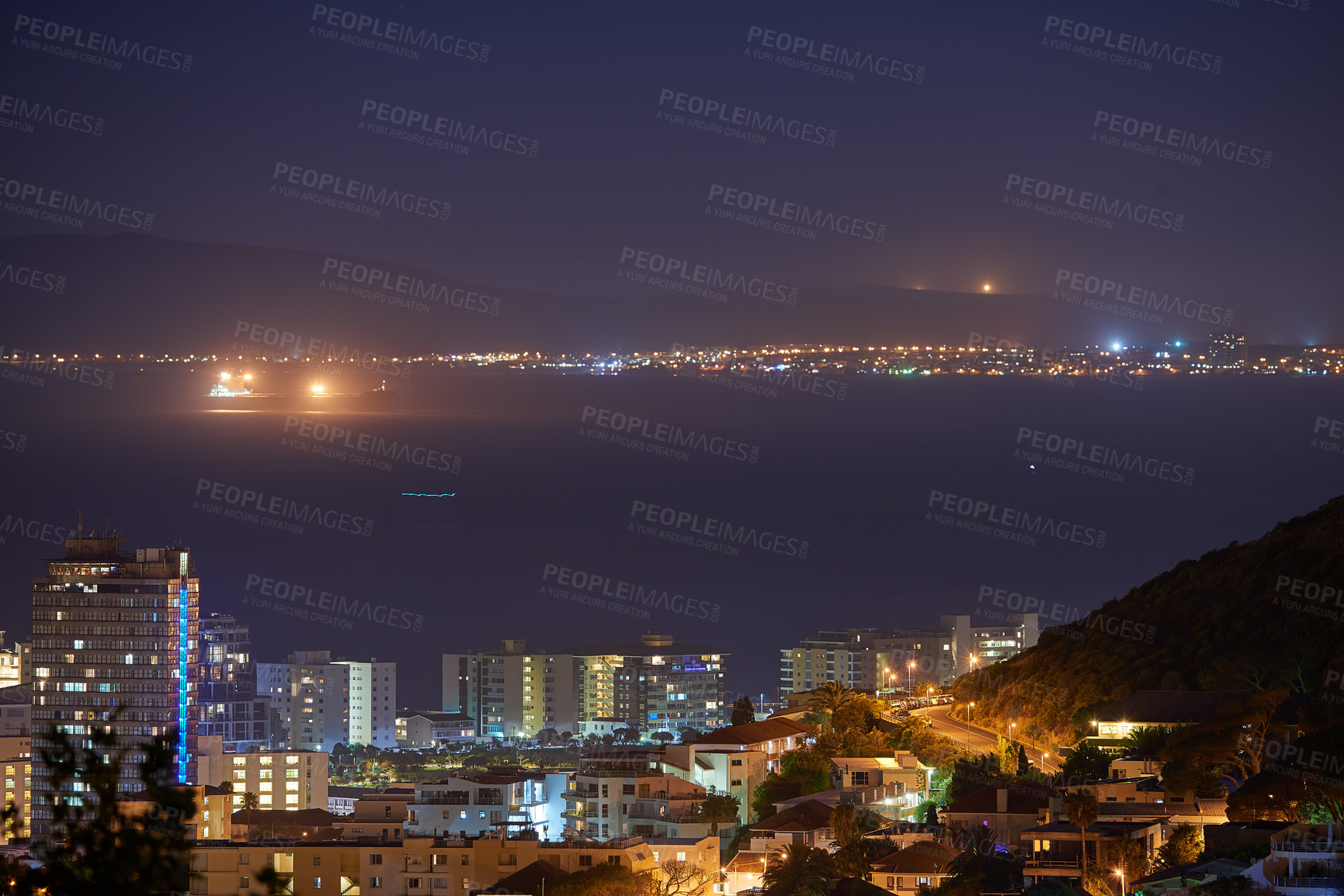 Buy stock photo Cityscape, night and ocean or urban landscape with buildings, boat and sea or outdoor. Development, skyline and port or light for shipping, cargo and tourism or travel for architecture or hospitality