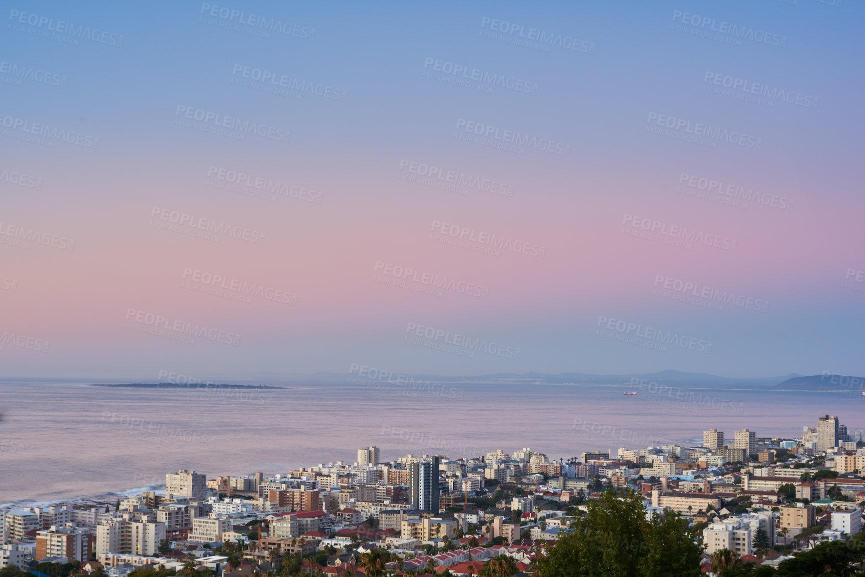 Buy stock photo Cityscape, sunset and water or urban landscape with buildings, tree and sea or outdoor. Development, skyline and coastline for shipping, cargo and tourism or travel for architecture and hospitality