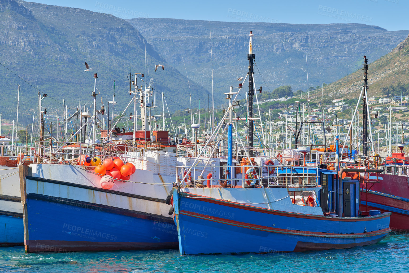 Buy stock photo Dock, ship and ocean for fishing with boats for shipping, coastline industry and summer scenery. Port, harbor and water, waves and sea for sailing, nature and seascape bay with holiday destination