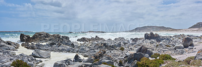 Buy stock photo Rocks, ocean and coastal scenery with shore and horizon for peace, travel destination and holiday location. Waves, blue sky and sea water for vacation landscape, panorama or environment in nature