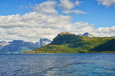 Buy stock photo Mountain, ocean and blue sky with clouds for nature adventure, holiday destination and travel by water. Natural environment, stratocumulus and sea with landscape, hill and vacation in South Africa