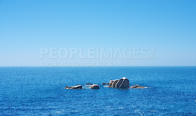 Buy stock photo Ocean, rocks and horizon in outdoor location, travel and peace in environment on sea vacation. Water, stone and calm beach on weekend trip, tropical island and holiday wallpaper of Caribbean skyline