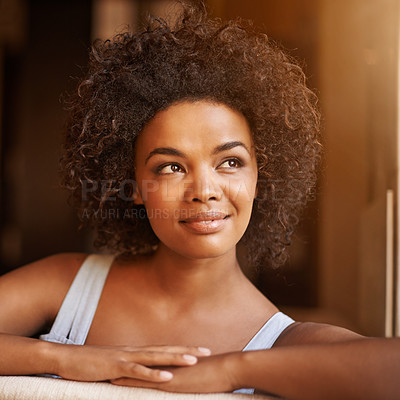 Buy stock photo Face, relax and thinking with afro black woman in living room of home for weekend inspiration or free time. Smile, future and vision with confident young person on sofa in apartment for comfort
