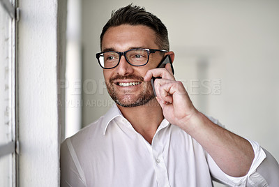 Buy stock photo Cropped shot of a businessman making a call in his office