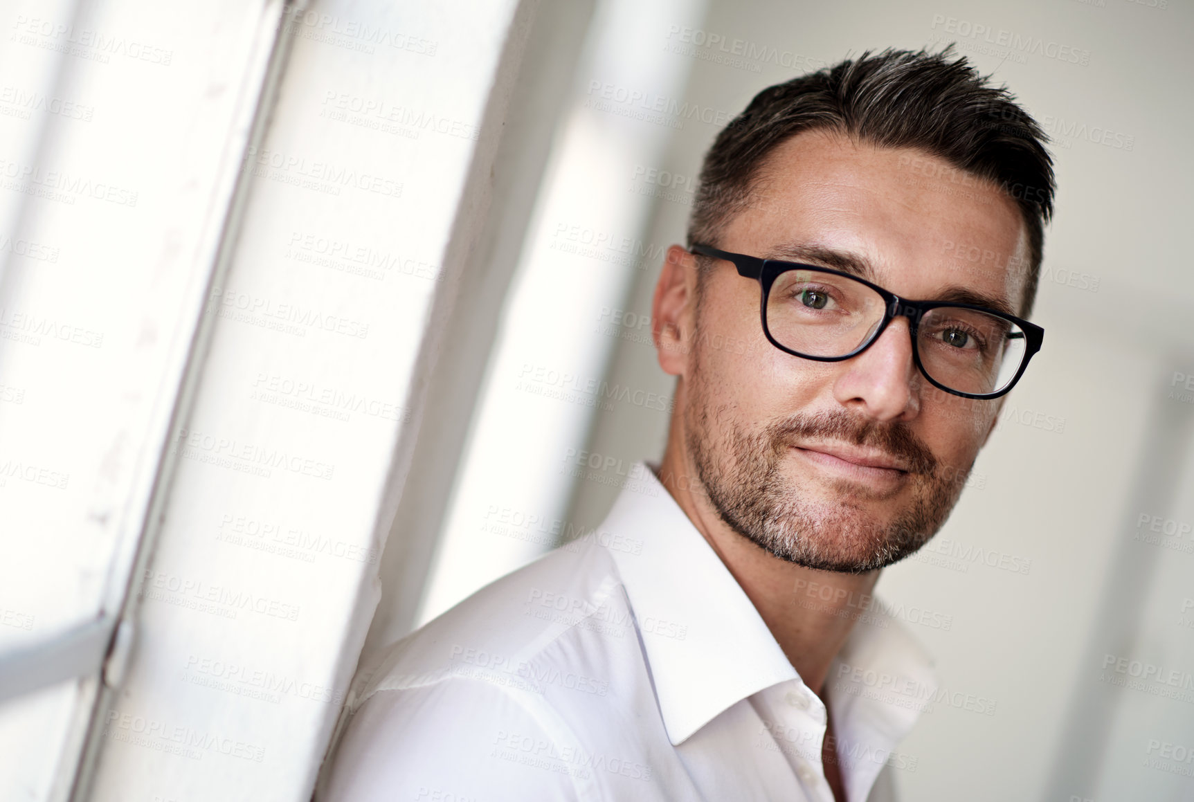 Buy stock photo Cropped portrait of a businessman standing in his office