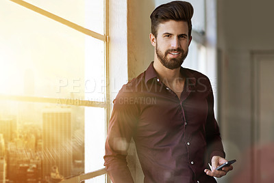 Buy stock photo Creative, man and portrait with smartphone by window for client feedback, project updates and timeline for task. Multimedia designer, lens flare and online for content approval and objectives.