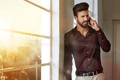 Buy stock photo Cropped shot of a businessman sending a text in his office
