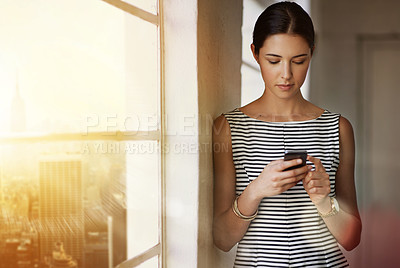 Buy stock photo Office, window and business woman with smartphone, connection and text message with client for service. Creative agency, female designer and cellphone for mobile app, contact and reading by city