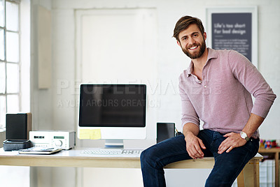 Buy stock photo Cropped portrait of a businessman sitting on a desk in his office