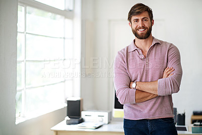 Buy stock photo Cropped portrait of a businessman standing with his arms folded in the office