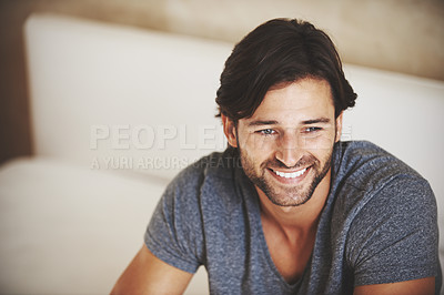 Buy stock photo A handsome young man at home