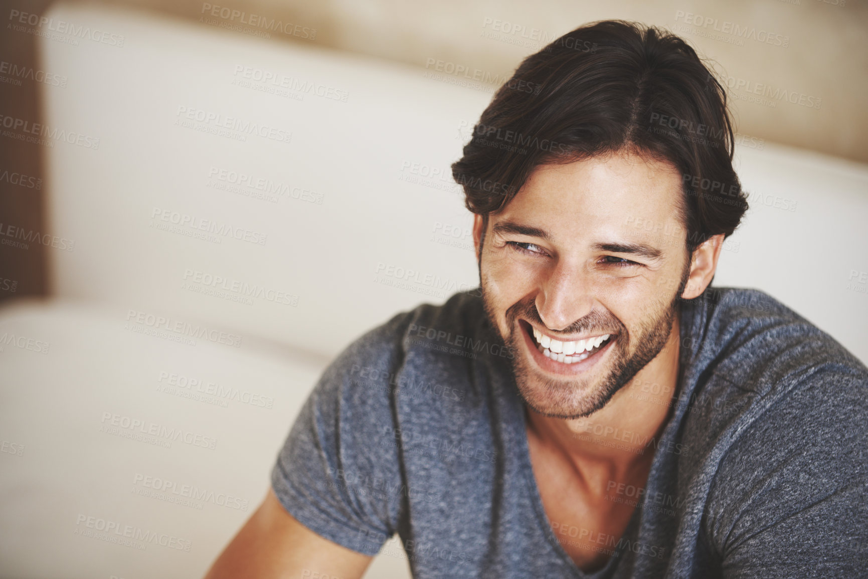 Buy stock photo A handsome young man at home