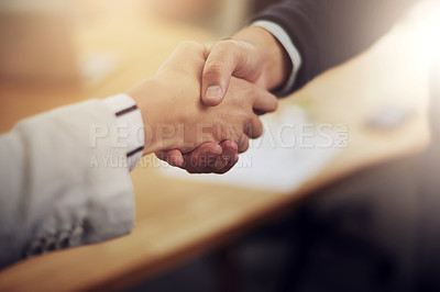 Buy stock photo Cropped shot of two businesspeople shaking hands