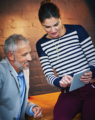 Buy stock photo Tablet, collaboration or question with manager and employee at desk in office together for review. Mentor, feedback and training with business people in dark workplace for research or online report