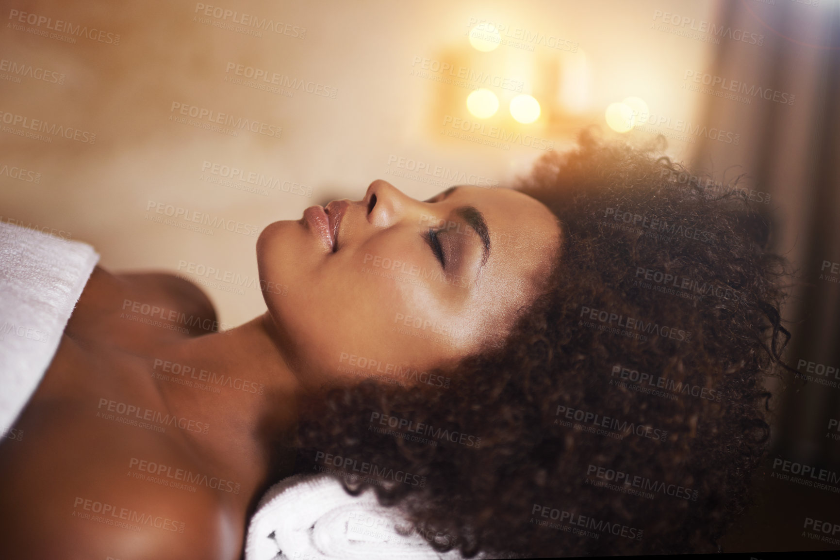 Buy stock photo Woman, relax and wellness in spa for beauty, tranquility and cosmetic treatment for break or peace. African person and natural for holistic health for skin, clean and hygiene with head on towel