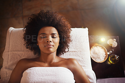 Buy stock photo Cropped shot of a beautiful young woman relaxing during a spa treatment