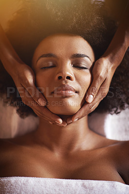 Buy stock photo Shot of a young woman getting a head massage at a beauty spa
