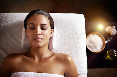 Buy stock photo Cropped shot of a beautiful young woman relaxing during a spa treatment
