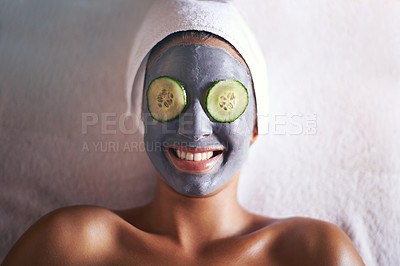 Buy stock photo Woman, face mask and smile with skin glow and cucumber for facial, spa wellness and beauty treatment. Above, towel and calm female person with skincare and relax at hotel with cosmetic cream