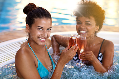 Buy stock photo Women, friends and wine in jacuzzi in portrait, self care and pamper day at spa for wellness and cold beverage. Water, bubbles and alcohol drink in hot tub for detox and friendship date for bonding
